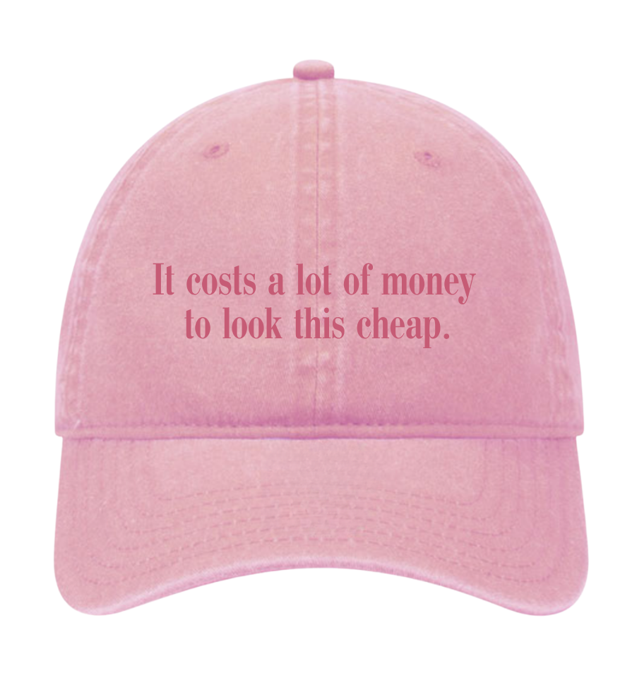 'IT COSTS A LOT OF MONEY TO LOOK THIS CHEAP' DOLLY HAT